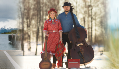 Header image. A composite image of three different images, the film poster for Hvor er ferga mi, A picture of the Band Arvvas posing with their instruments in a snowy forest, and Elina Ijäs posing in a field, covered in a blanket